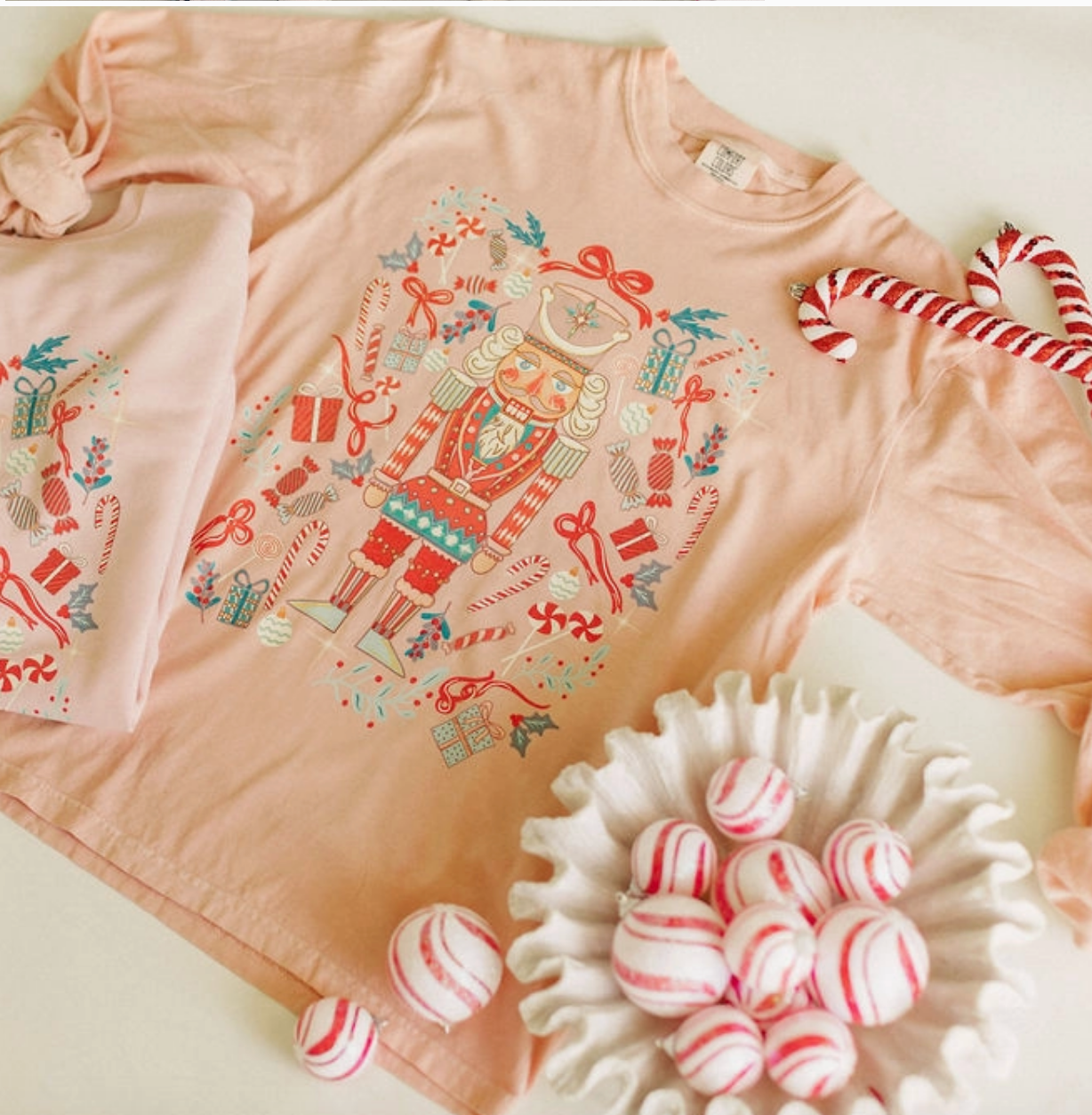 Whimsical Nutcracker Christmas graphic long sleeve tee printed on Comfort Colors cotton β Nutcracker Long Sleeve from Frost Impressions Boutique.