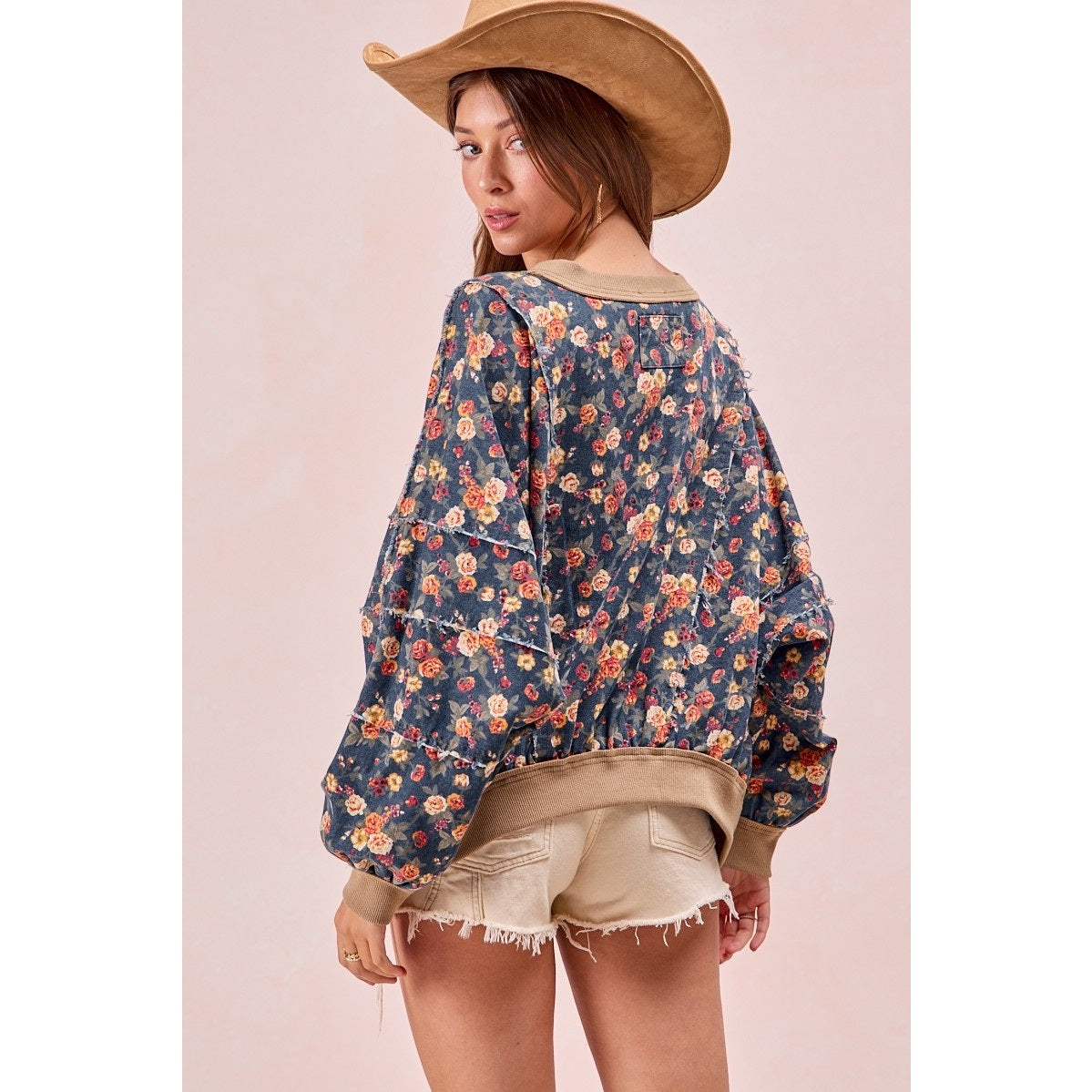 Washed floral denim top with frayed edges and relaxed fit β available at Frost Impressions Boutique in Wapakoneta, Ohio.