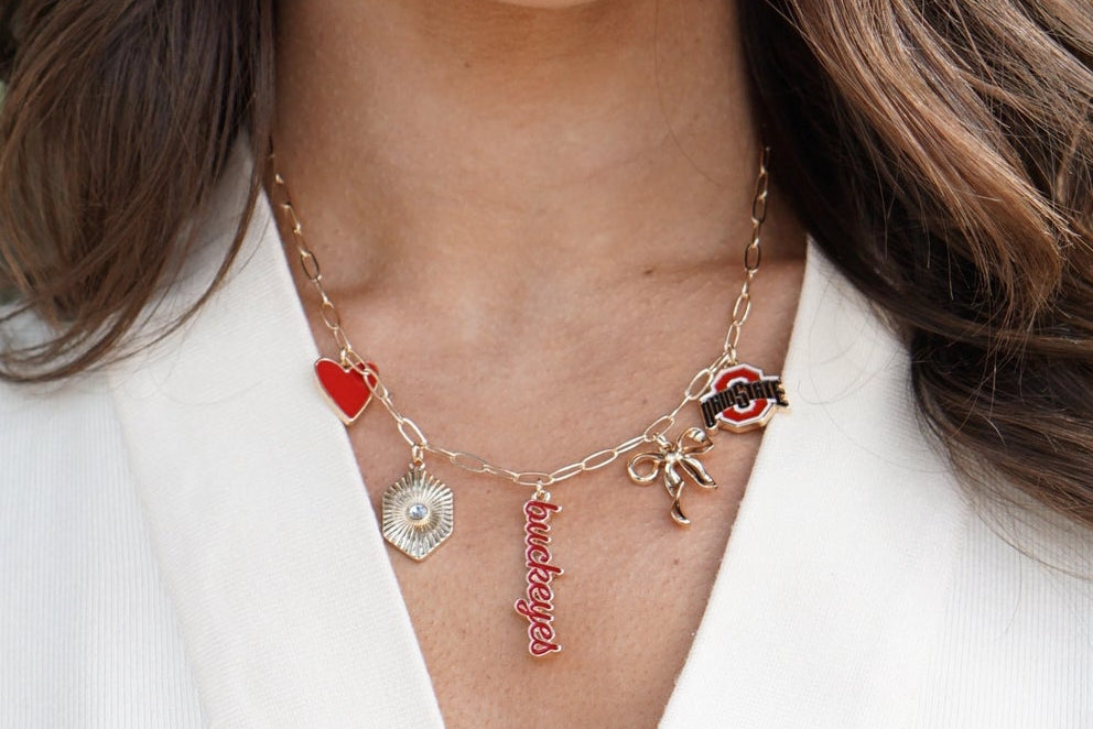 Gold buckeye charm necklace with red and silver accent beads — Frost Impressions Boutique, Wapakoneta, Ohio.