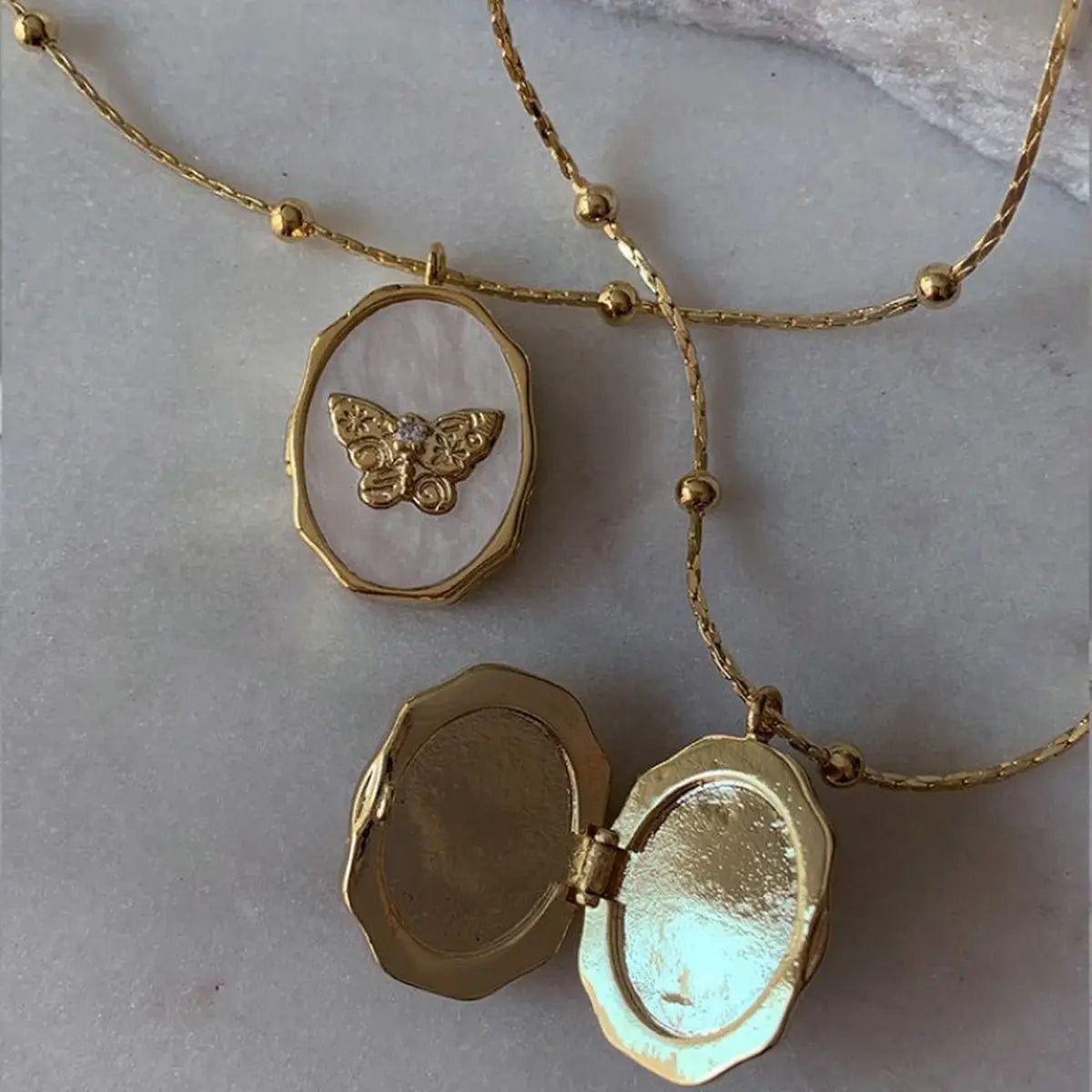 Butterfly Locket Necklace — vintage gold butterfly pendant photo locket necklace from Frost Impressions Boutique in Wapakoneta, Ohio.
