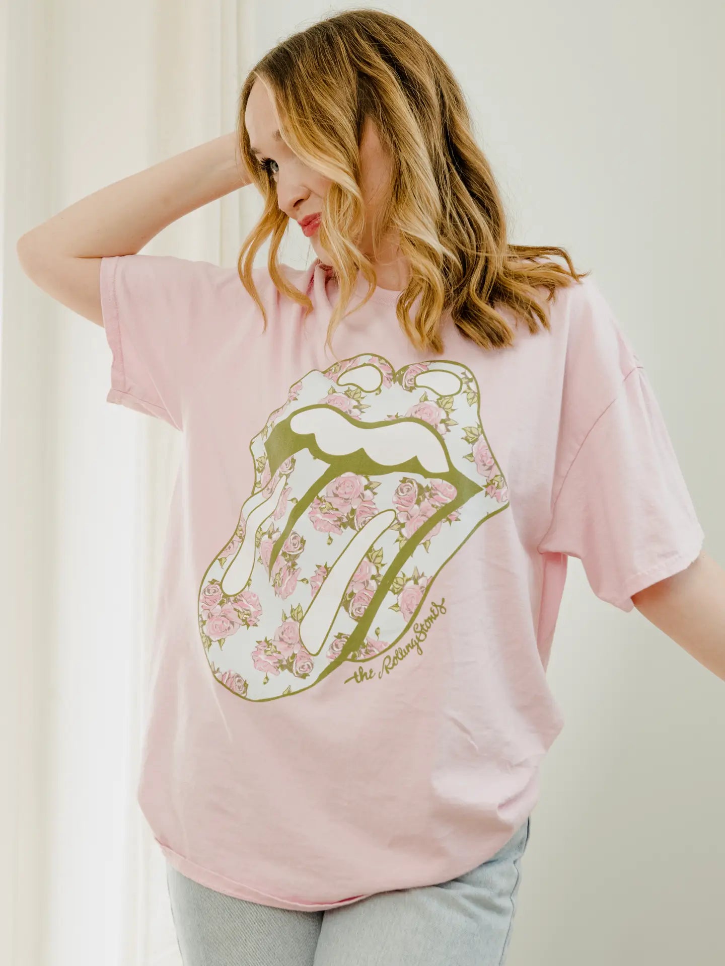 Light pink distressed Rolling Stones graphic tee with vintage wash and relaxed fit
