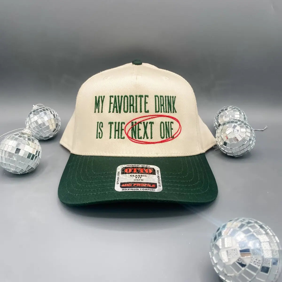 “My Favorite Drink Is the Next One” embroidered trucker hat — bold statement hat with mesh back and adjustable snap.