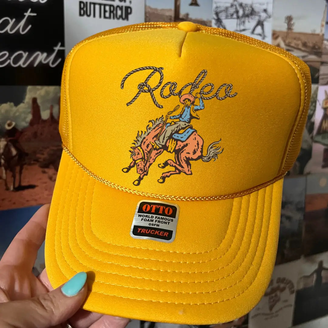 Trucker hat with Rodeo Gold graphic design and mesh back in a casual everyday style