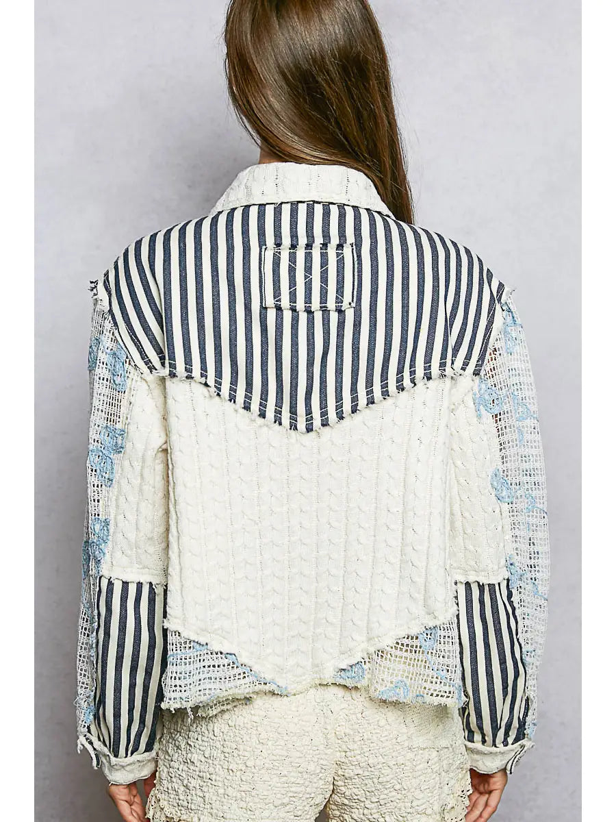 Blue patchwork long sleeve woven jacket with cable knit and lace floral details, button front, and relaxed fit