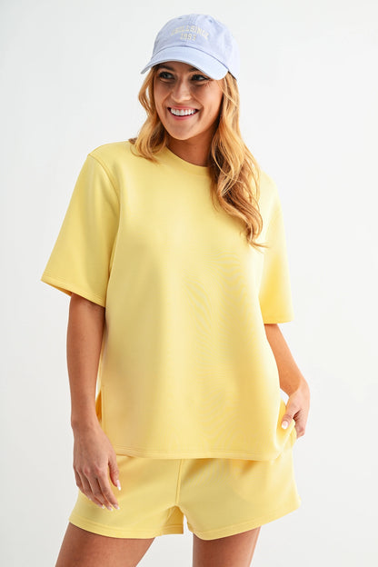 Butter soft scuba tee set with short sleeve top and matching shorts featuring elastic waistband and pockets in a relaxed fit