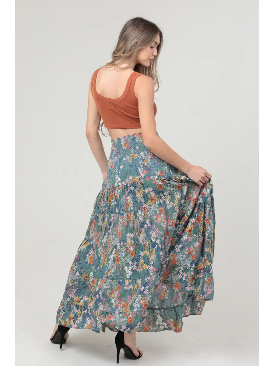 Green floral tiered maxi skirt with smocked waistband and flowy A-line silhouette