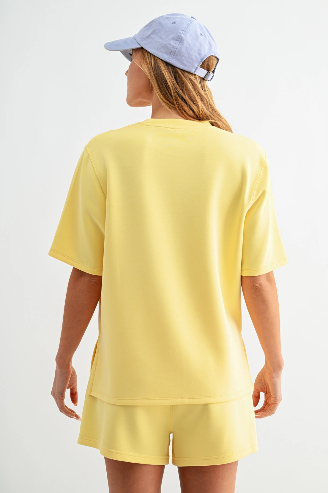 Butter soft scuba tee set with short sleeve top and matching shorts featuring elastic waistband and pockets in a relaxed fit