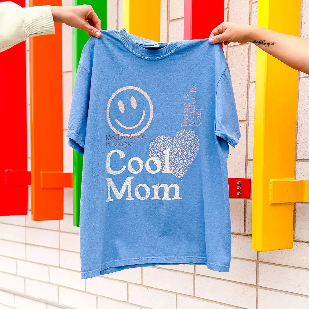 Periwinkle blue Comfort Colors graphic tee with “Cool Mom” design in a relaxed fit