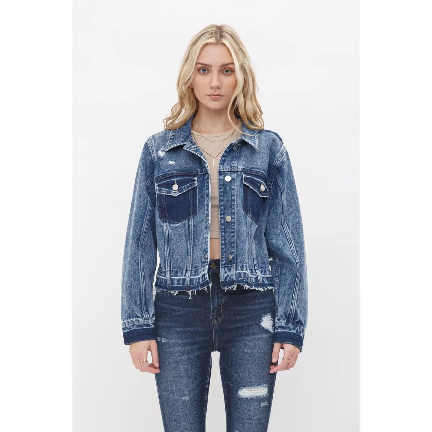 Boyfriend style cropped denim jacket with undone hem, relaxed fit, and classic button front