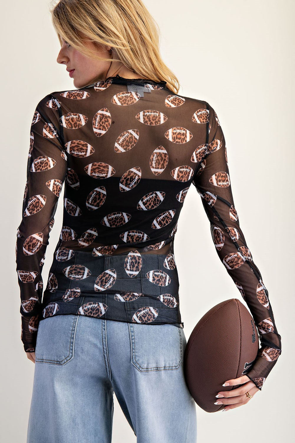 Sheer leopard football print mesh layering top with thumbhole cuffs — Friday Night Fierce Top from Frost Impressions Boutique.