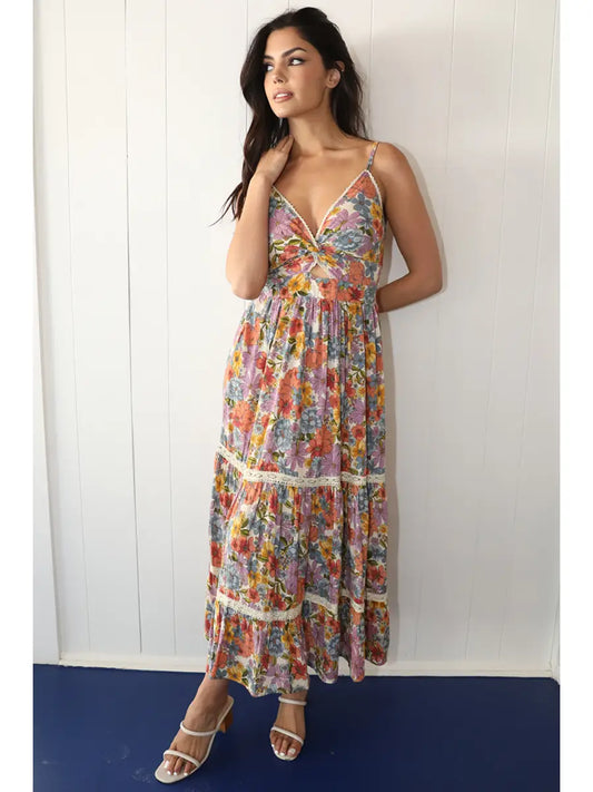 Off-white floral maxi dress with twist front detail, front cutout, and lace accents in a flowy silhouette