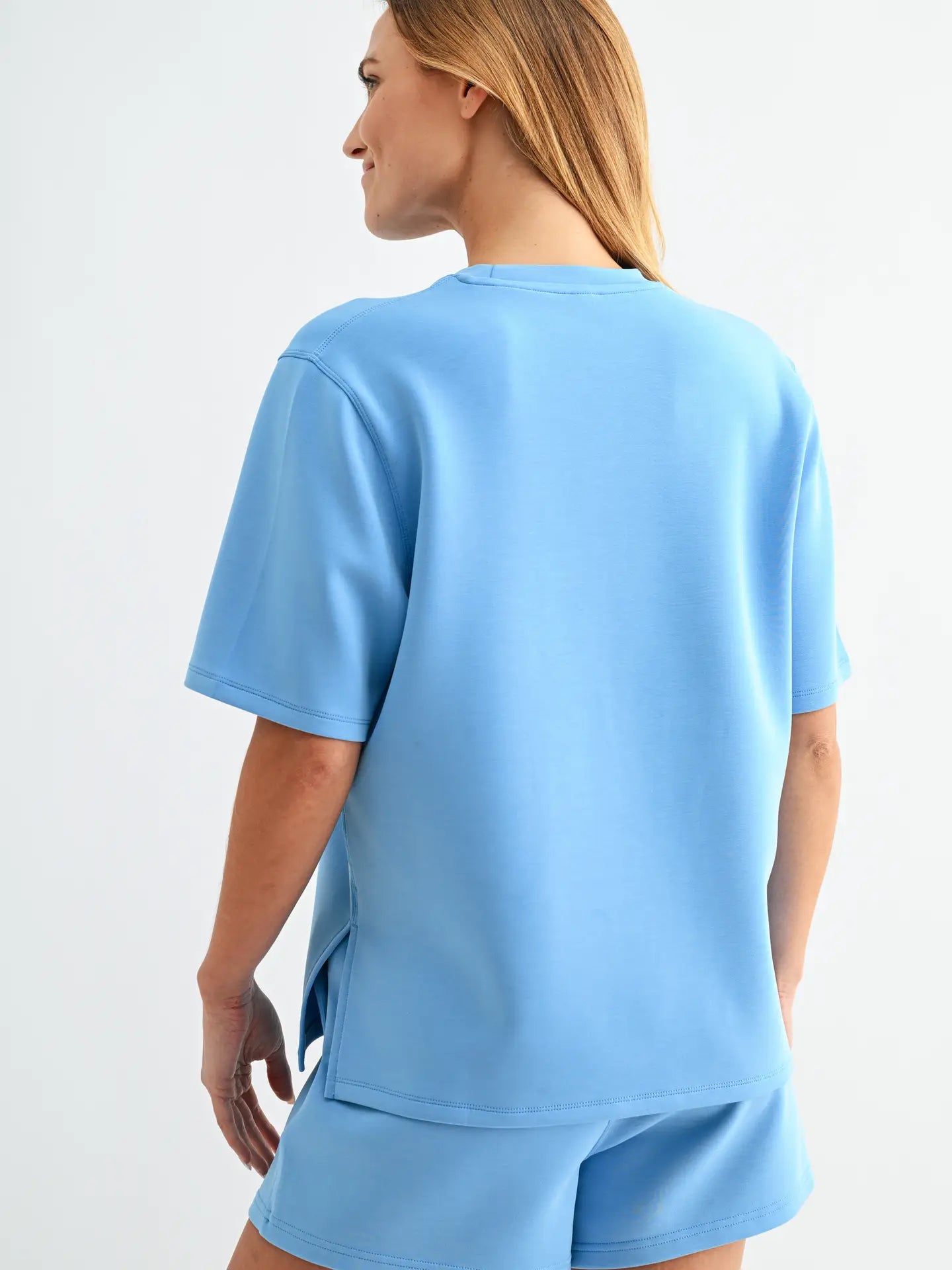 Butter soft scuba tee set with short sleeve top and matching shorts featuring elastic waistband and pockets in a relaxed fit
