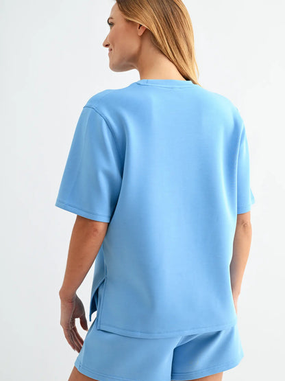 Butter soft scuba tee set with short sleeve top and matching shorts featuring elastic waistband and pockets in a relaxed fit