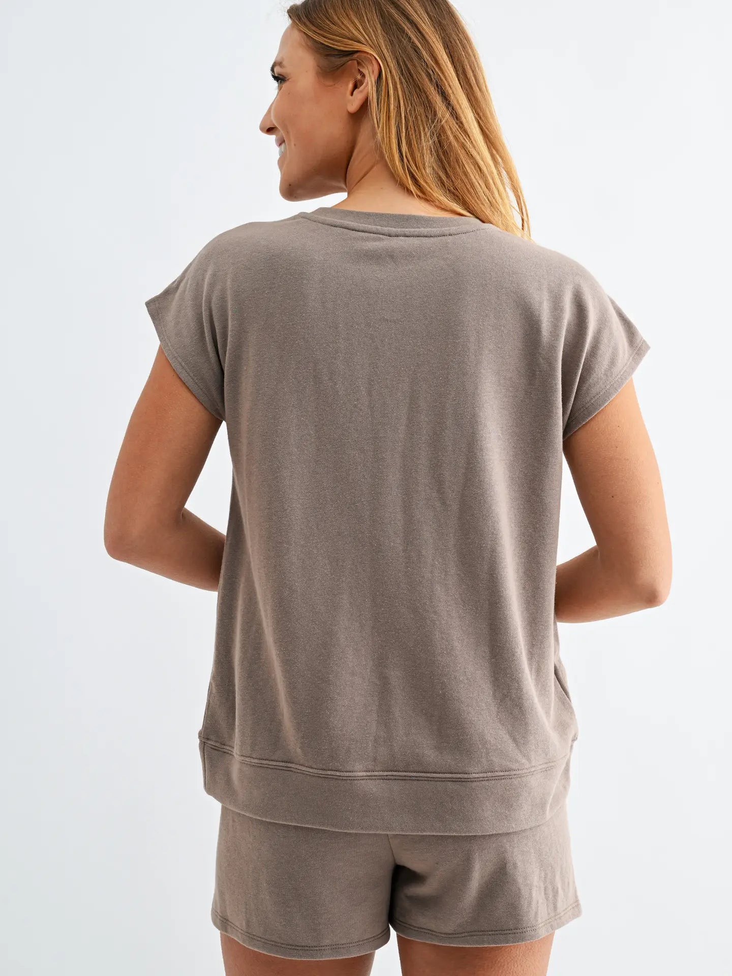 Taupe lounge set with cap sleeve top and matching shorts featuring elastic drawstring waistband and oversized pockets