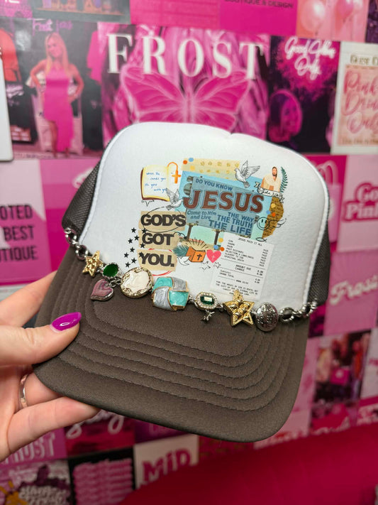 Trucker hat with “God’s Got You” graphic and mesh back in a faith-inspired casual style