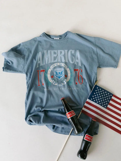 Denim Comfort Wash graphic tee with vintage America 1776 design and relaxed unisex fit