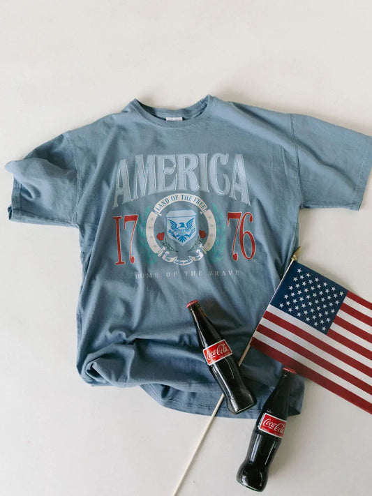 Denim Comfort Wash graphic tee with vintage America 1776 design and relaxed unisex fit