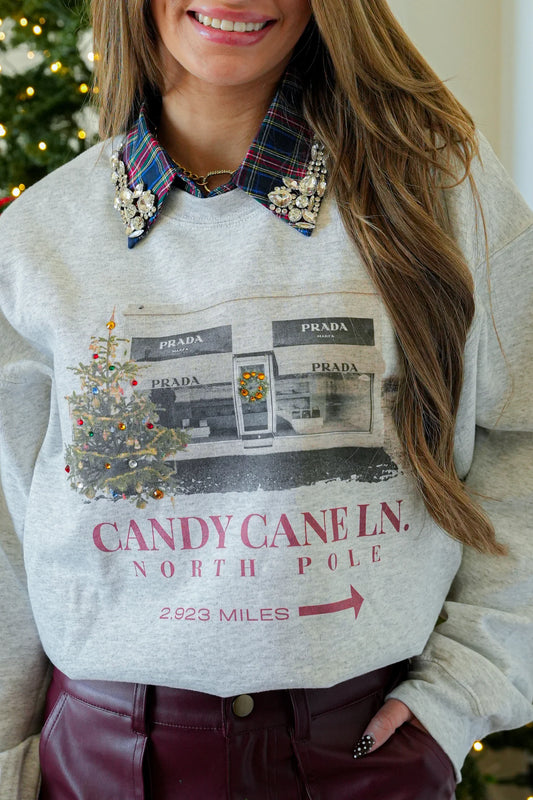 Ash Gildan crewneck sweatshirt with Candy Cane Lane DTG print and stone detailing — Candy Cane Ln Crewneck from Frost Impressions Boutique.