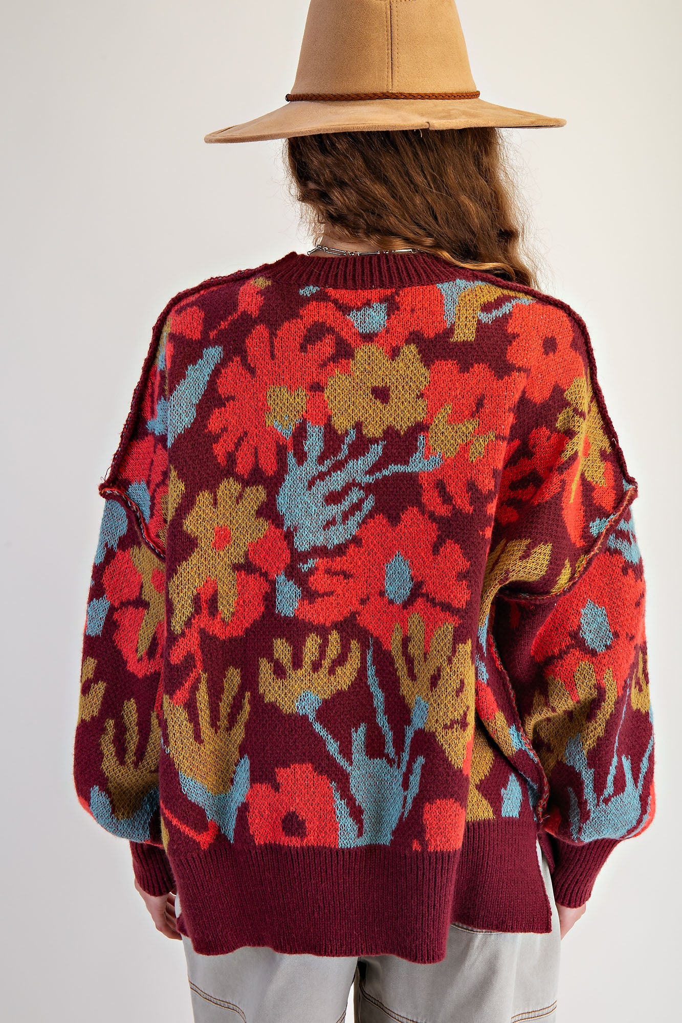 Burgundy floral patterned oversized sweater pullover with crew neckline and side slits — Bloom Haven Floral Sweater (Burgundy) from Frost Impressions Boutique.