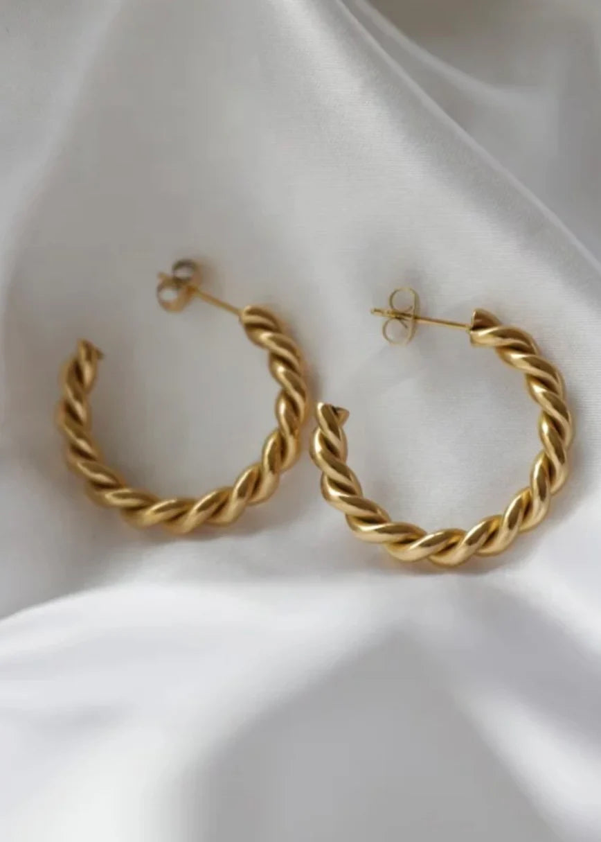 Gold Medium Twist Hoops — 18k gold plated stainless steel water-resistant earrings with lifetime warranty, available at Frost Impressions Boutique in Wapakoneta, Ohio.