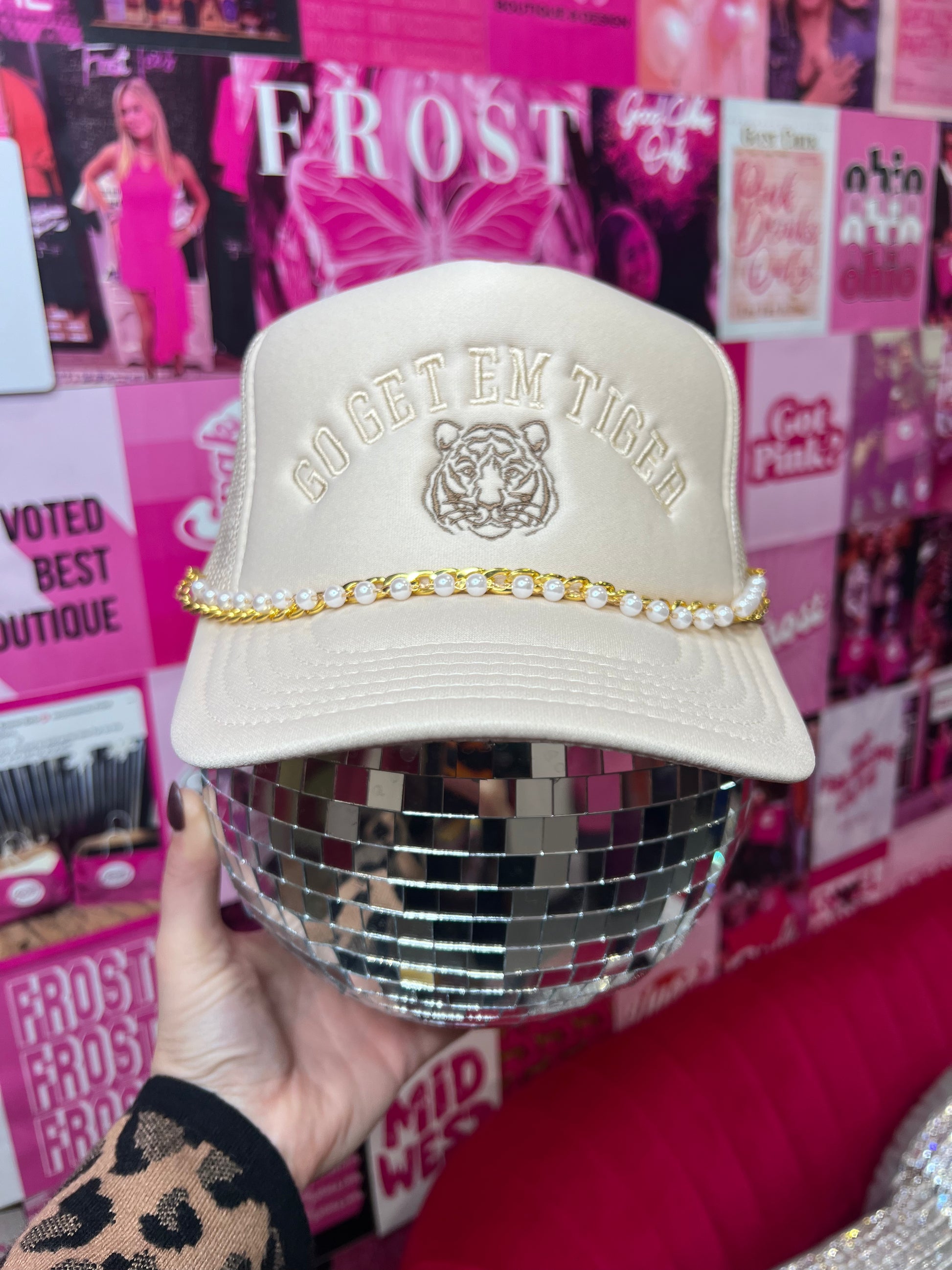 “Go Get ’Em Tiger” patch trucker hat — bold boutique hat with mesh back and adjustable snap closure.