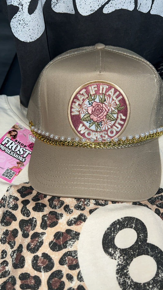 “What If It All Works Out” patched trucker hat with silver hat chain and mesh back.