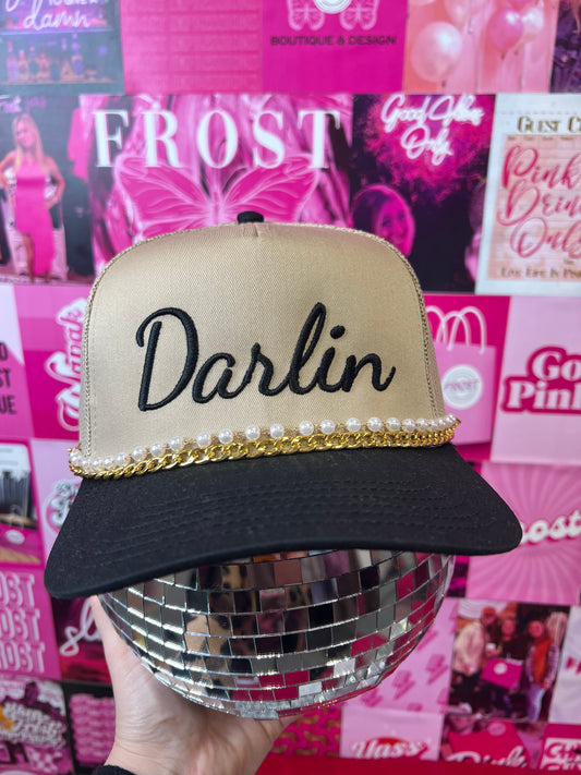“Darlin’” hand-embroidered trucker hat — boutique trucker hat with breathable mesh back and adjustable snap closure.