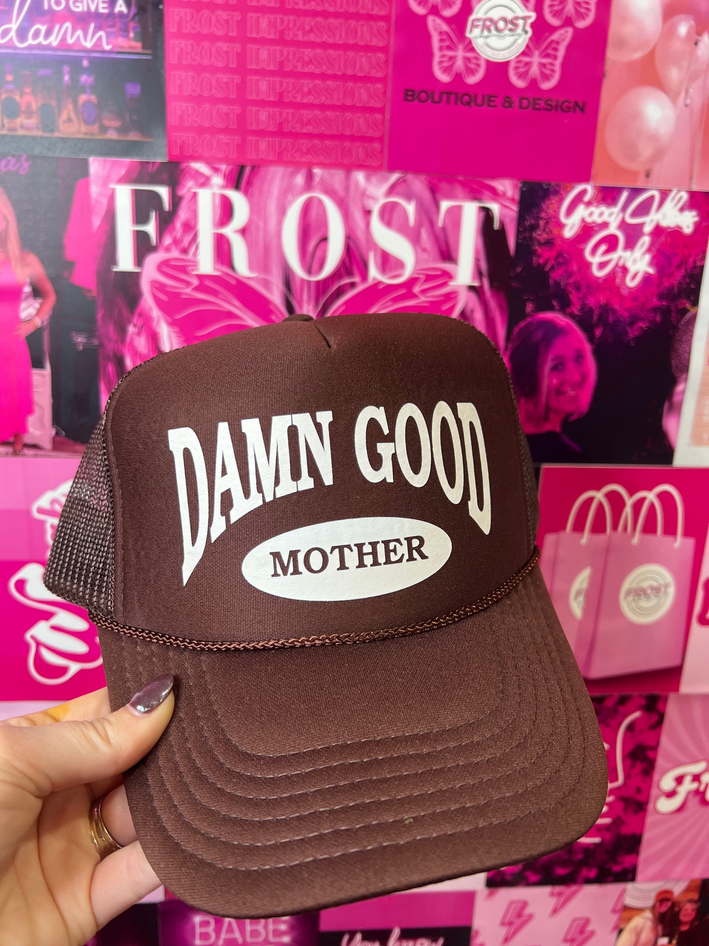 Dark brown Otto foam trucker hat with “Damn Good Mother” embroidered design — trendy boutique trucker hat from Frost Impressions Boutique in Wapakoneta, Ohio.