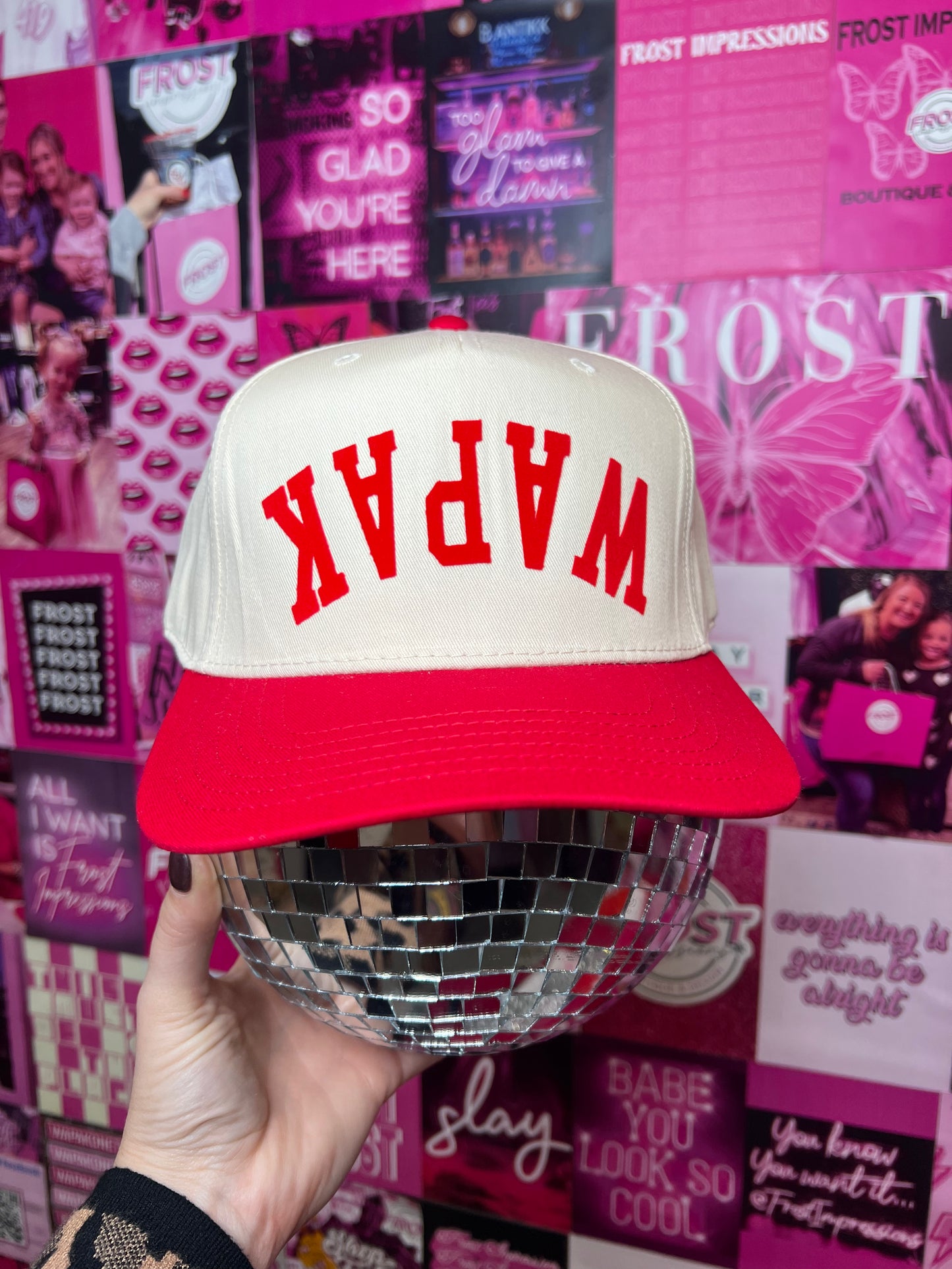 Red and cream foam trucker hat with bold upside-down “WAPAK” graphic — trendy small-town statement hat from Frost Impressions Boutique in Wapakoneta, Ohio.