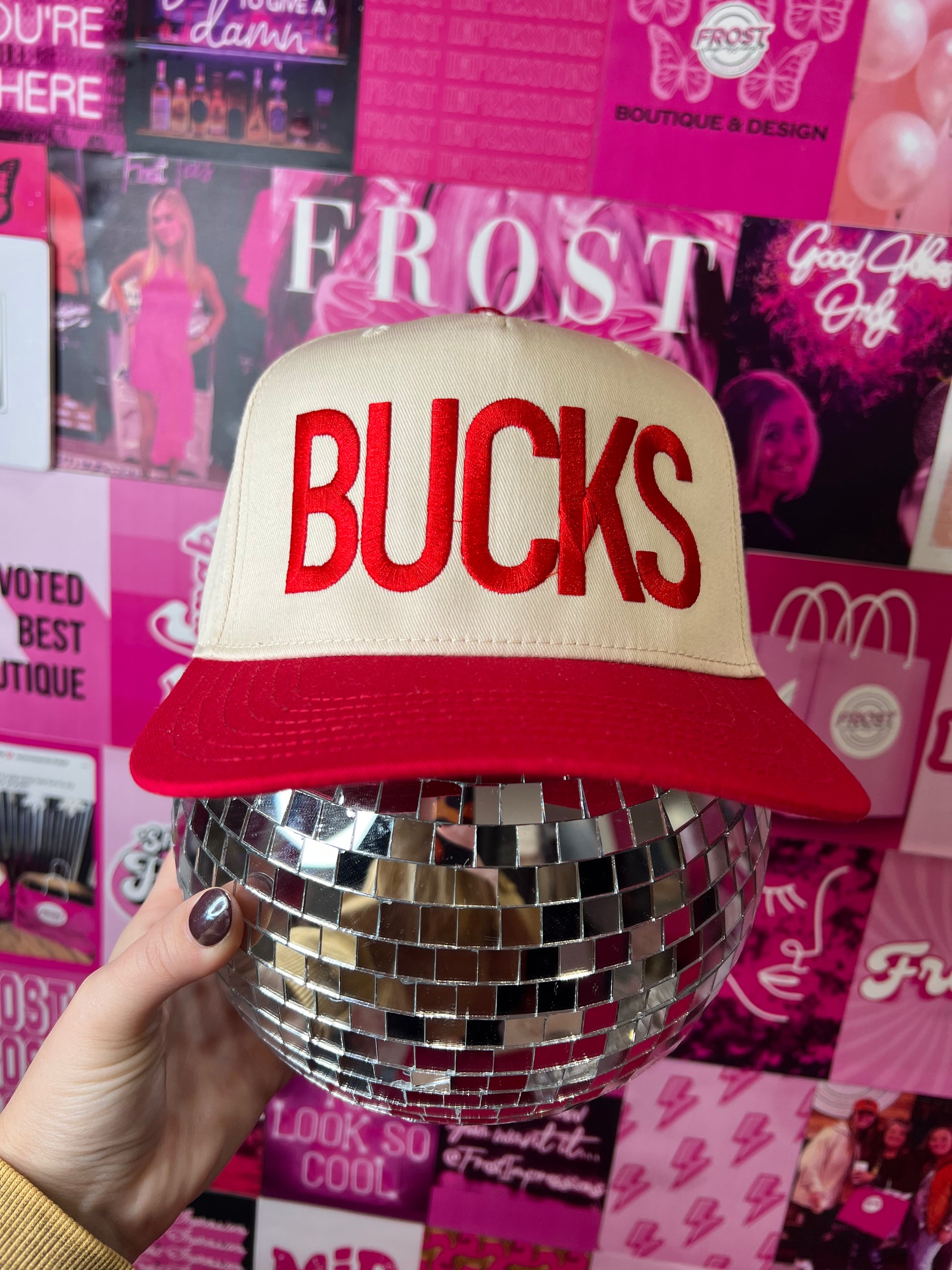 Red and cream Otto trucker hat with bold “BUCKS” design — trendy gameday hat from Frost Impressions Boutique in Wapakoneta, Ohio.
