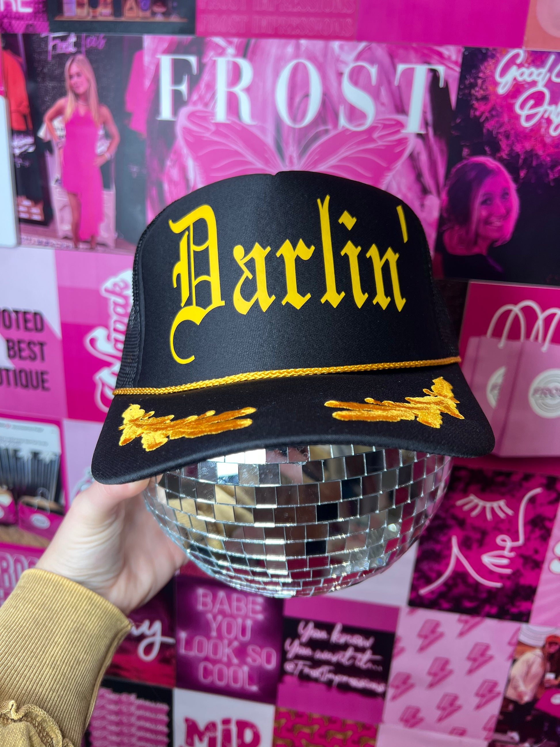Black captain-style Otto trucker hat with “Darlin’” design — trendy boutique hat from Frost Impressions Boutique in Wapakoneta, Ohio.