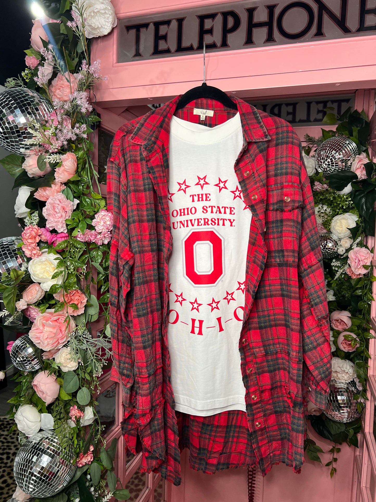 White oversized OSU graphic tee with red star design — trendy game day top from Frost Impressions Boutique in Wapakoneta, Ohio.