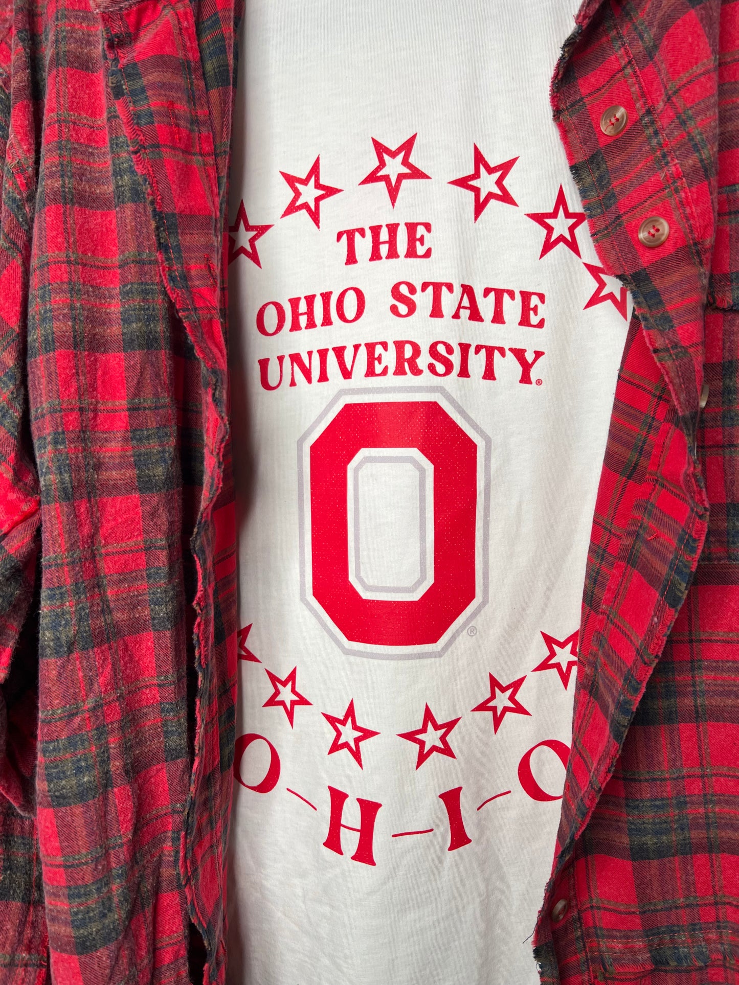 White oversized OSU graphic tee with red star design — trendy game day top from Frost Impressions Boutique in Wapakoneta, Ohio.