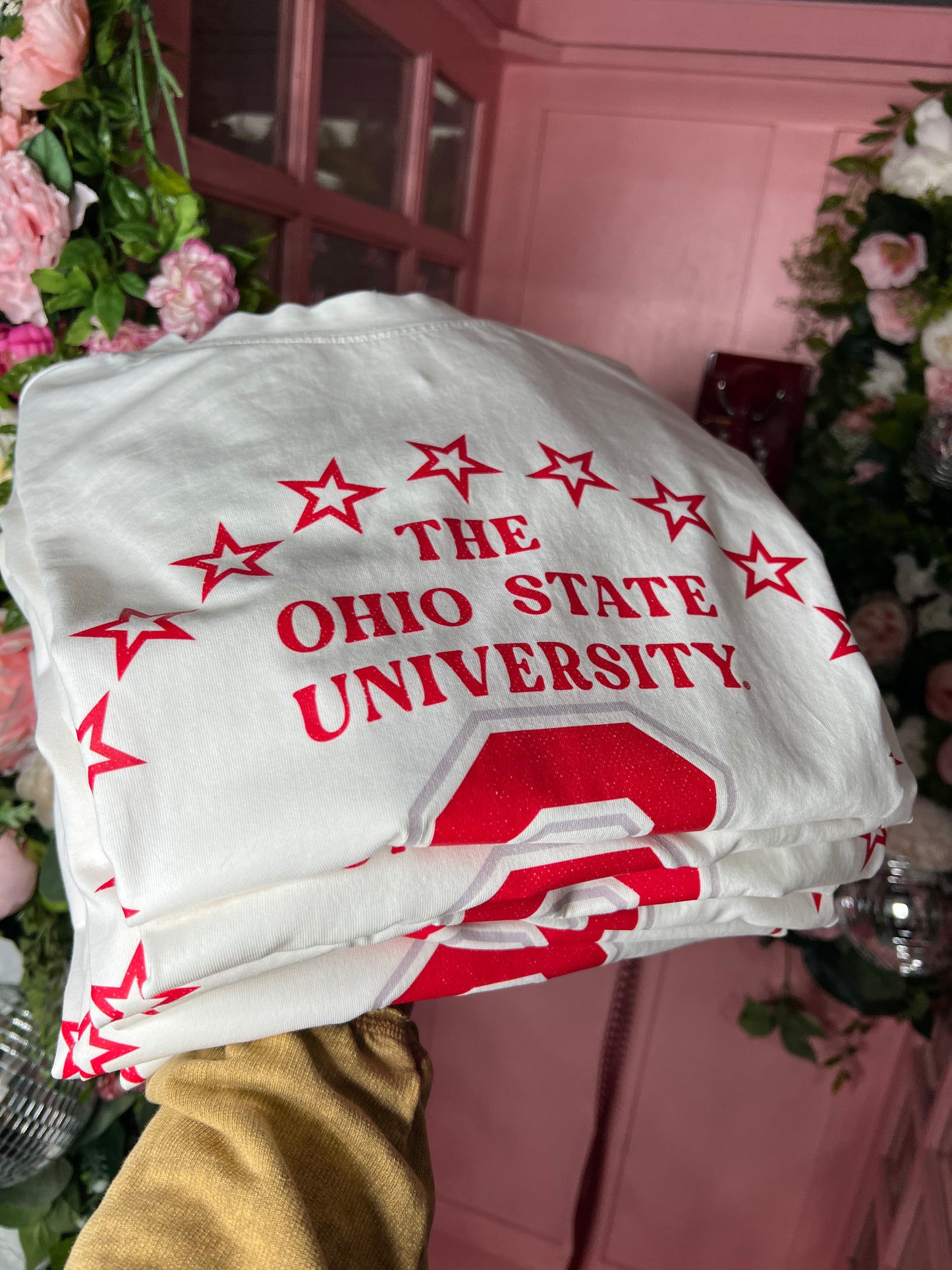 White oversized OSU graphic tee with red star design — trendy game day top from Frost Impressions Boutique in Wapakoneta, Ohio.