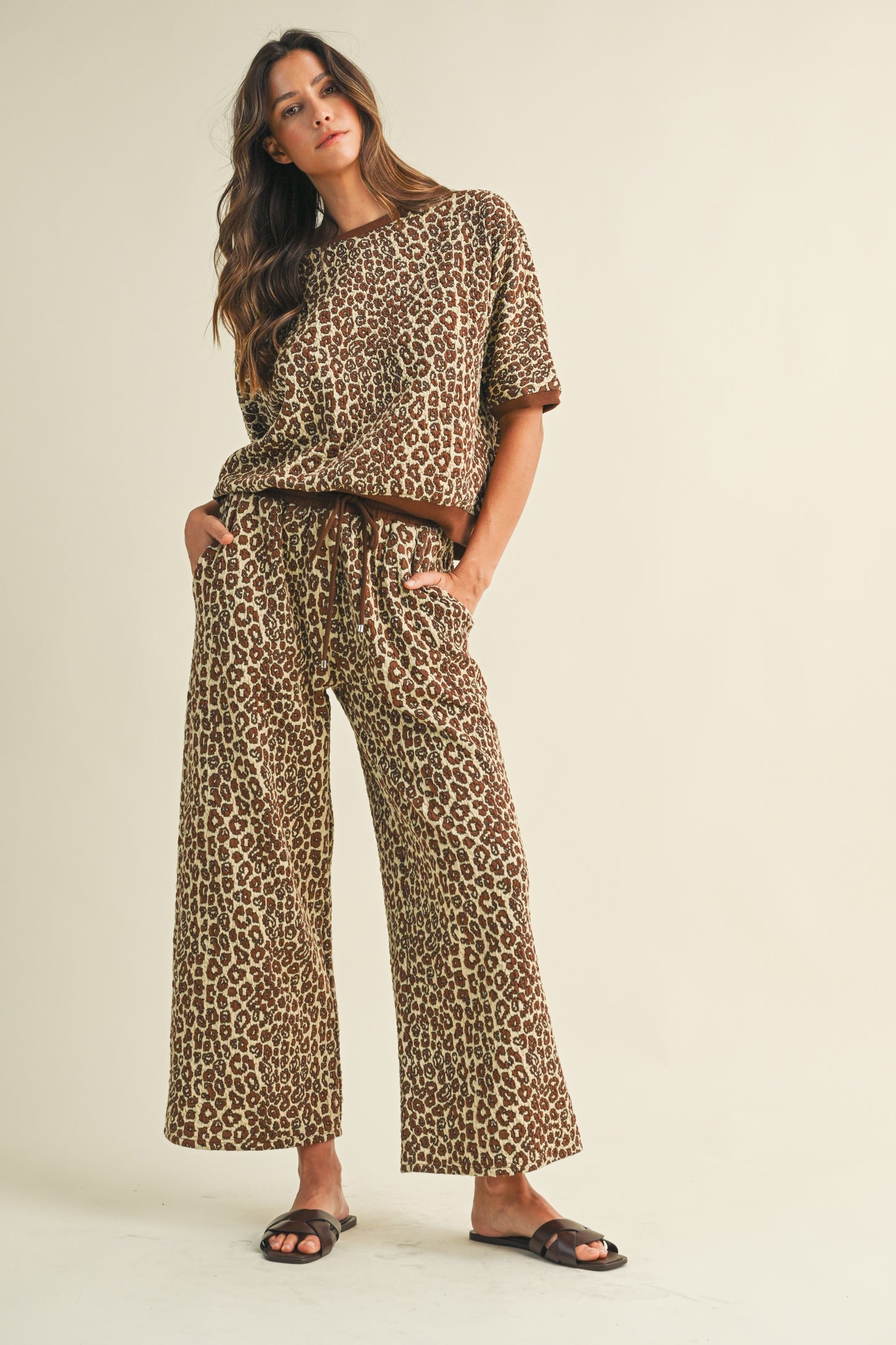 Luxe Leopard Lounge Set — leopard jacquard textured knit top with contrast band and cropped wide leg pants with drawstring waistband.