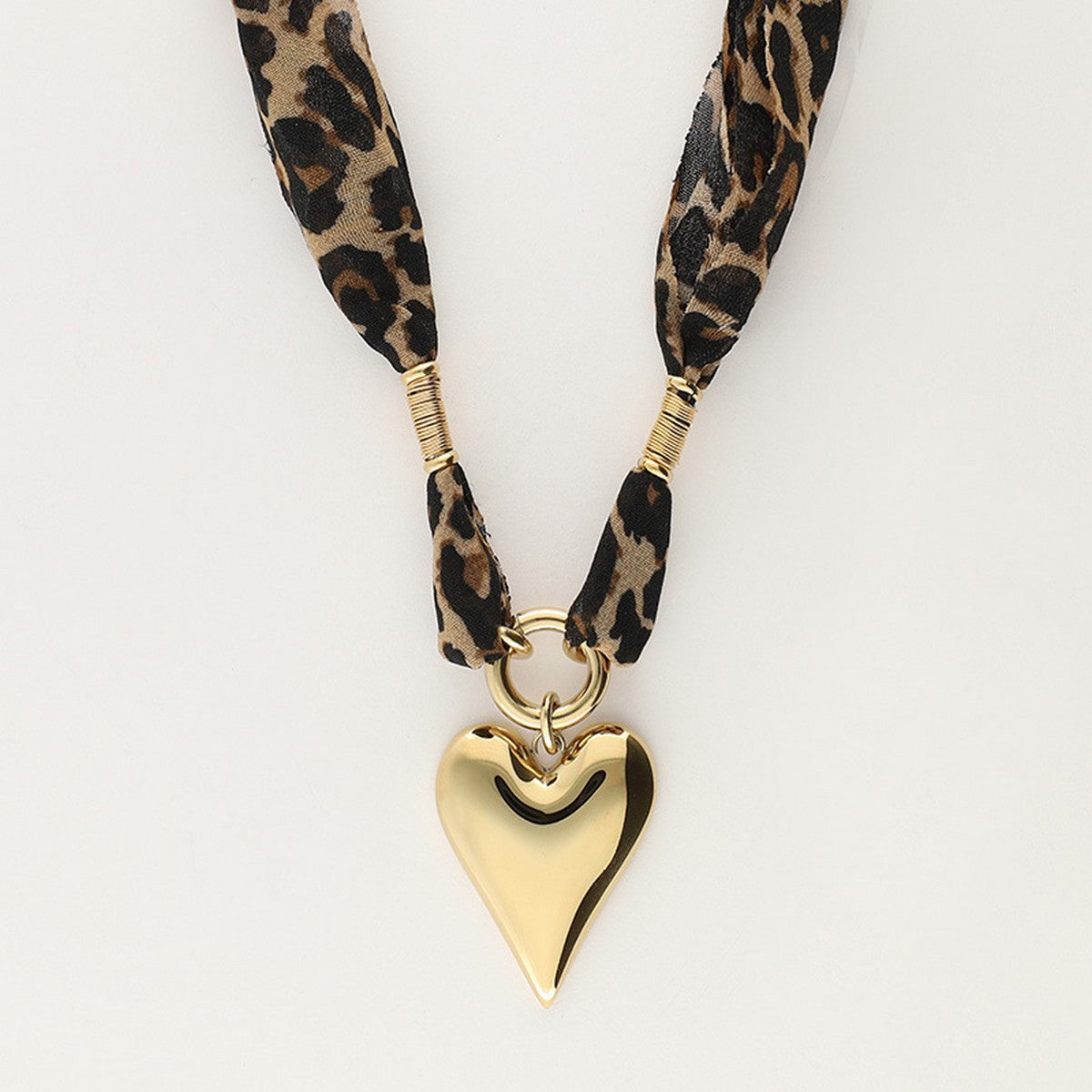 Leopard Print Heart Stainless Steel Necklace — heart-shaped leopard print pendant on stainless steel chain from Frost Impressions Boutique in Wapakoneta, Ohio.