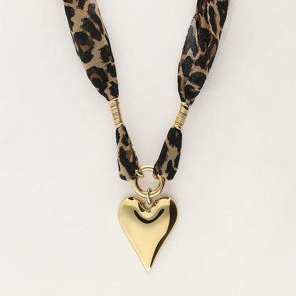 Leopard Print Heart Stainless Steel Necklace — heart-shaped leopard print pendant on stainless steel chain from Frost Impressions Boutique in Wapakoneta, Ohio.