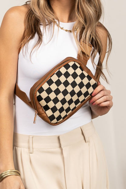 Mixed Media Check Sling (Cognac) — brown vegan leather and checkered canvas sling crossbody bag with gold hardware, available at Frost Impressions Boutique in Wapakoneta, Ohio.