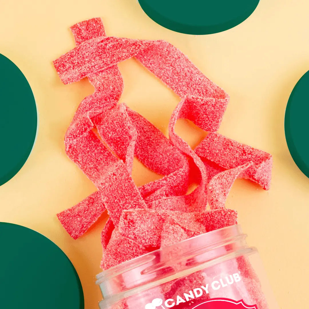 Avery’s Santa’s Belts from Candy Club — strawberry sour candy belts with sugar sanding, available at Sweet Impressions by Avery.