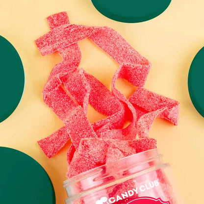 Avery’s Santa’s Belts from Candy Club — strawberry sour candy belts with sugar sanding, available at Sweet Impressions by Avery.