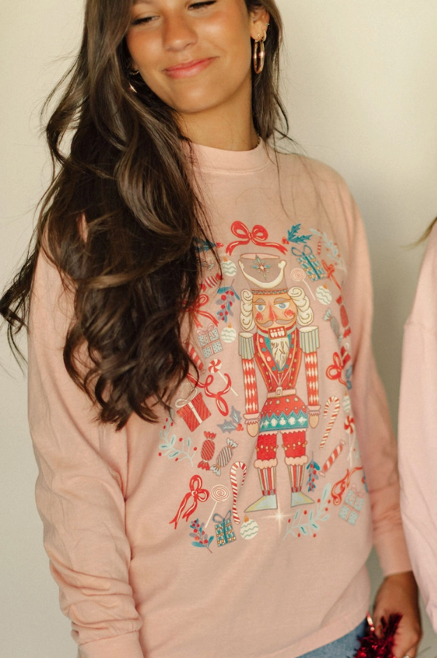 Whimsical Nutcracker Christmas graphic long sleeve tee printed on Comfort Colors cotton — Nutcracker Long Sleeve from Frost Impressions Boutique.