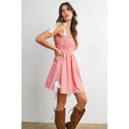 Strapless gingham mini sundress with shirred smocked bodice and flowy skirt