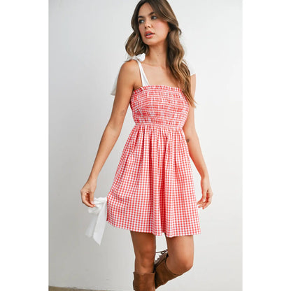 Strapless gingham mini sundress with shirred smocked bodice and flowy skirt