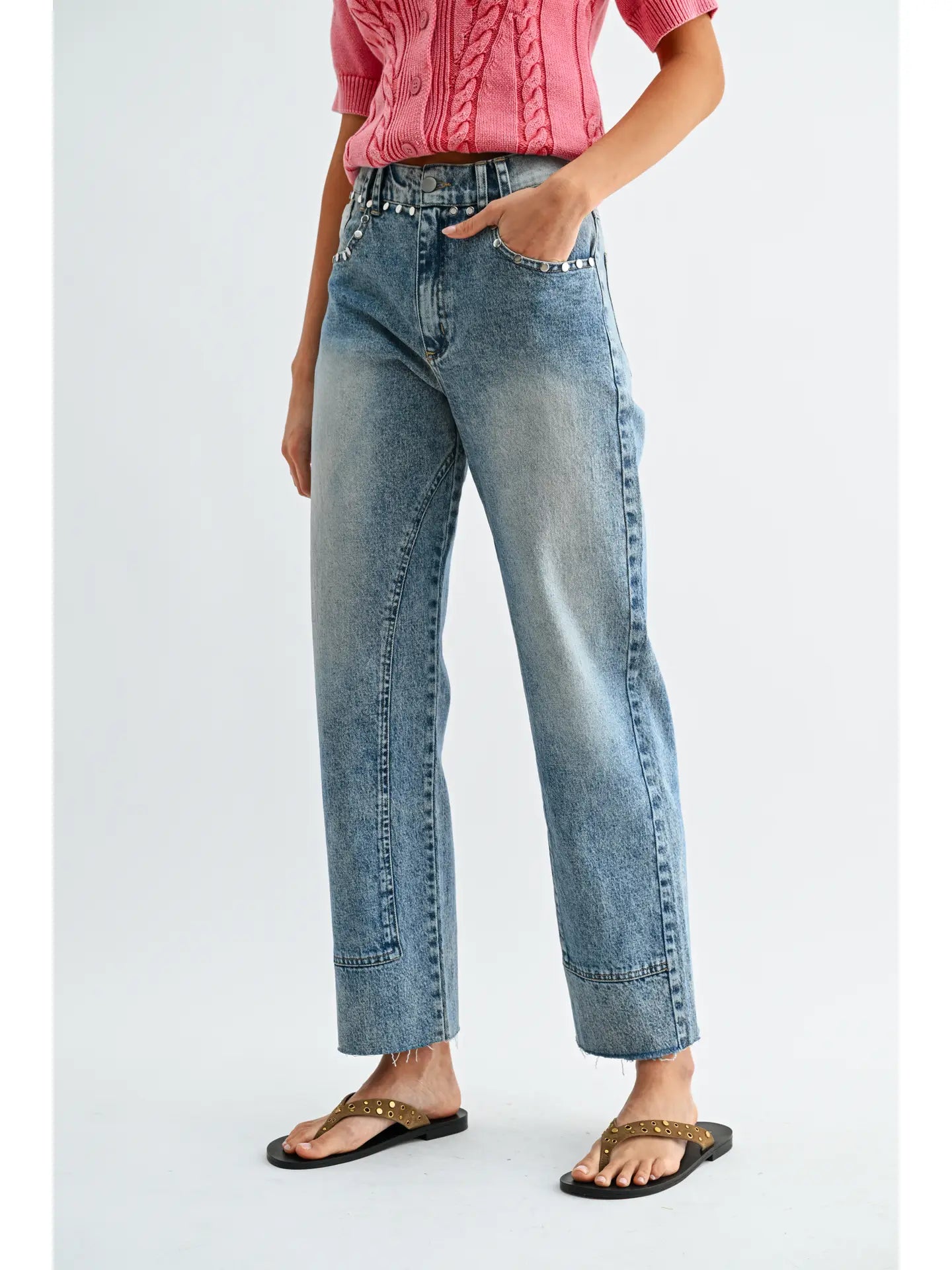 High waist straight leg jeans with studded detailing, medium wash denim, and subtle fading