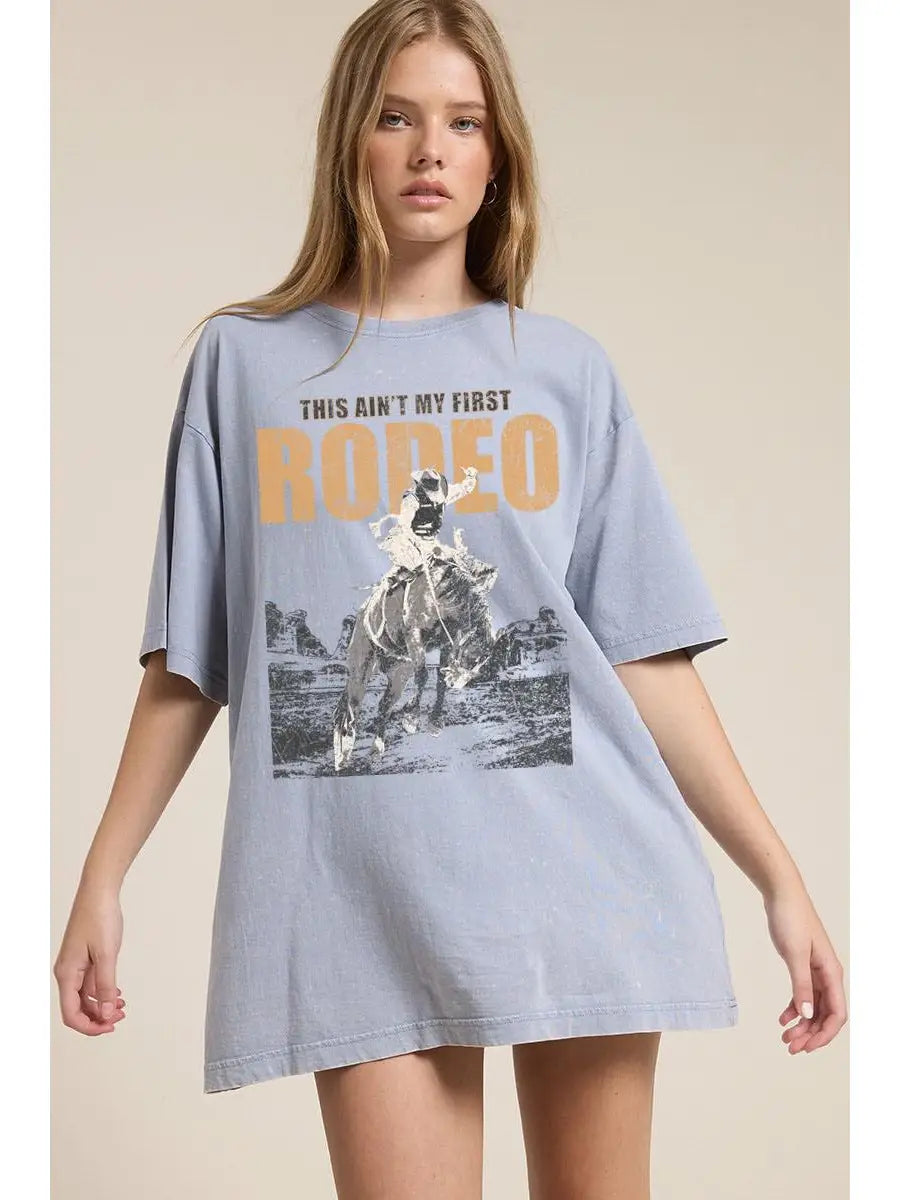 Ain’t My First Rodeo Tee — denim blue mineral acid washed western graphic boyfriend tee from Frost Impressions Boutique.