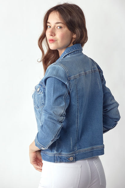 Vintage washed denim jacket with classic button front, soft denim fabric, and timeless fit