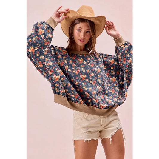 Washed floral denim top with frayed edges and relaxed fit — available at Frost Impressions Boutique in Wapakoneta, Ohio.