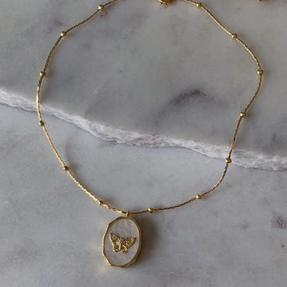 Butterfly Locket Necklace — vintage gold butterfly pendant photo locket necklace from Frost Impressions Boutique in Wapakoneta, Ohio.