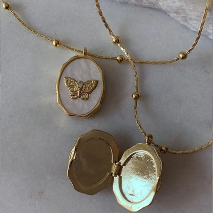 Butterfly Locket Necklace — vintage gold butterfly pendant photo locket necklace from Frost Impressions Boutique in Wapakoneta, Ohio.