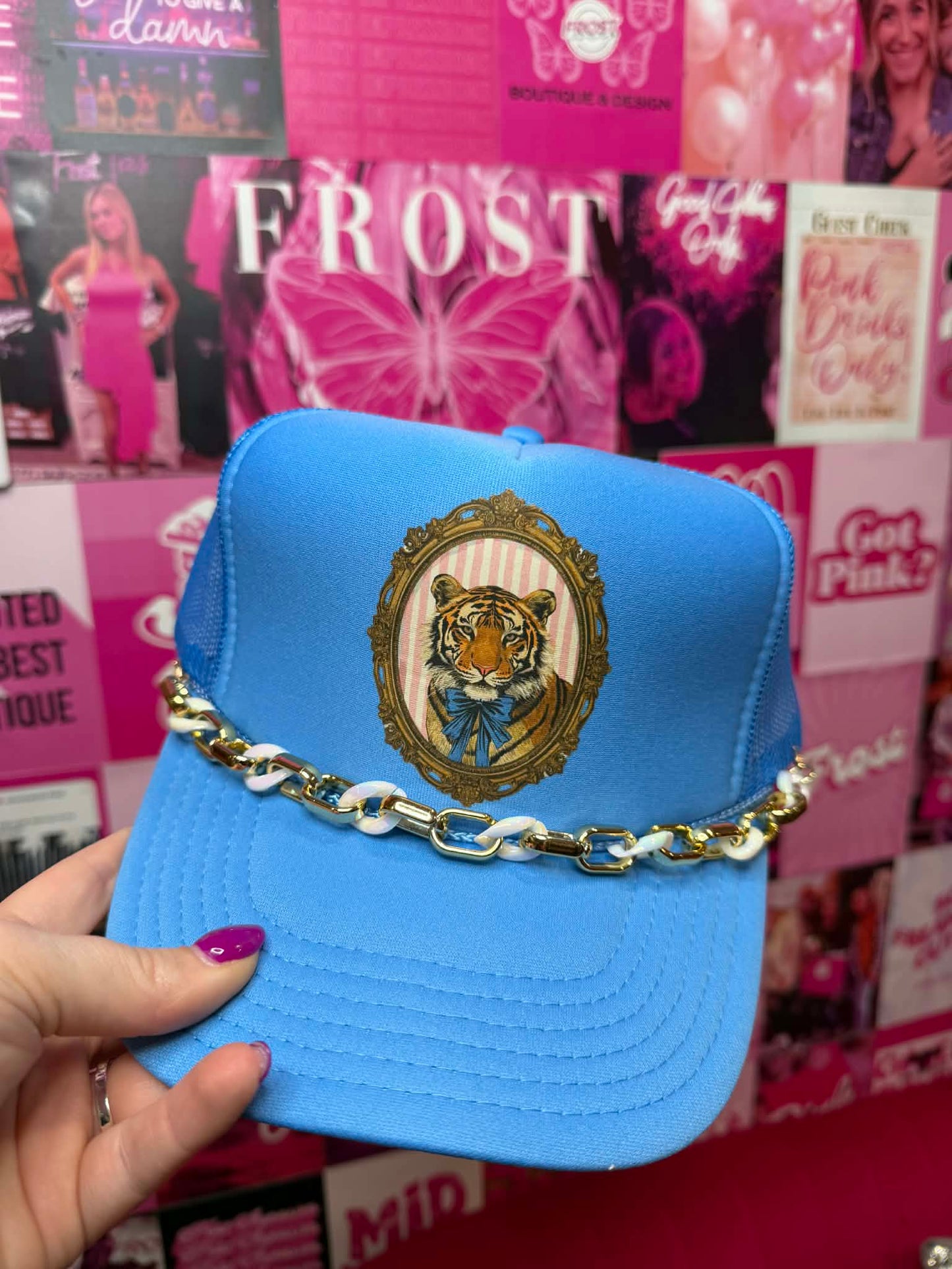Blue trucker hat with tiger graphic design and breathable mesh back